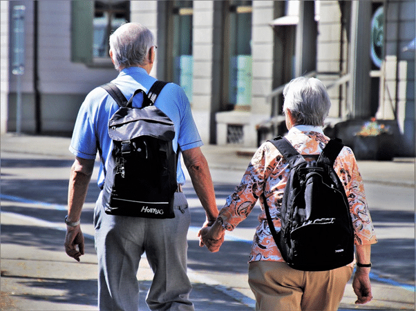 seniors with backpacks traveling in Europe