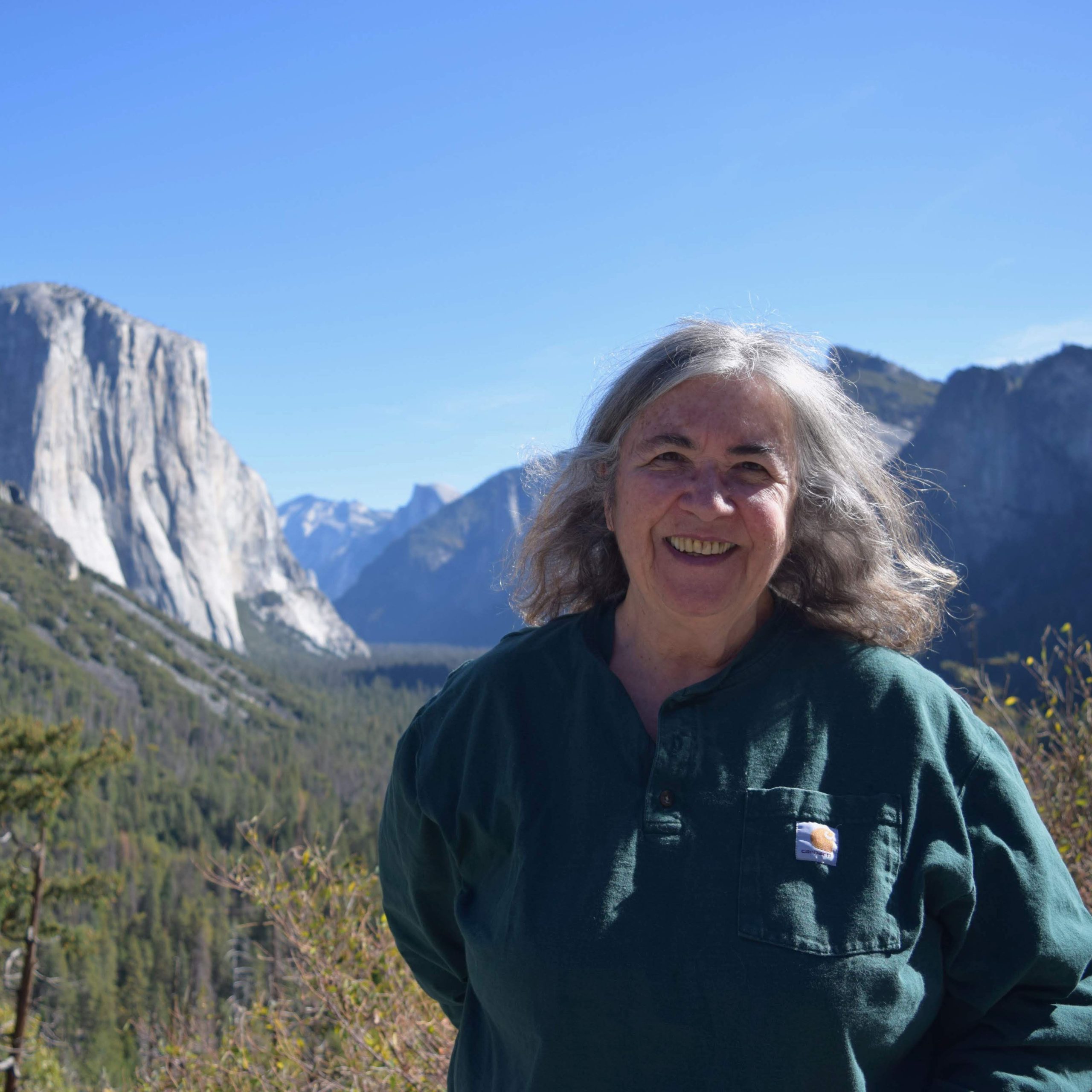 Marylee MacDonald standing with view of Yosemite in background